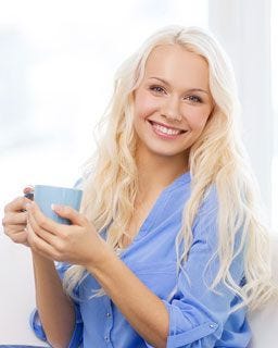 Beautiful lady enjoying a cup of coffee