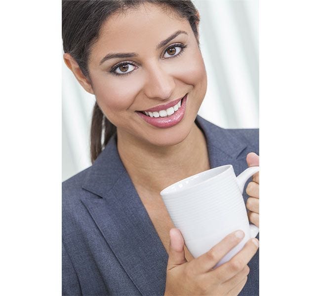 Beautiful lady drinking maxwell house coffee