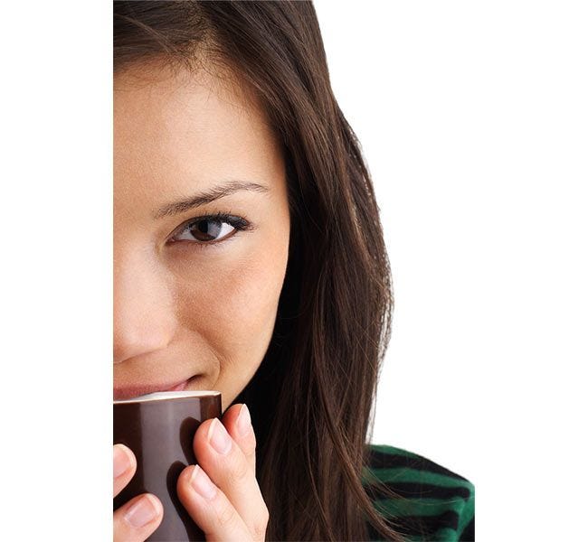 Lady with a cup of 100% Colombian Coffee